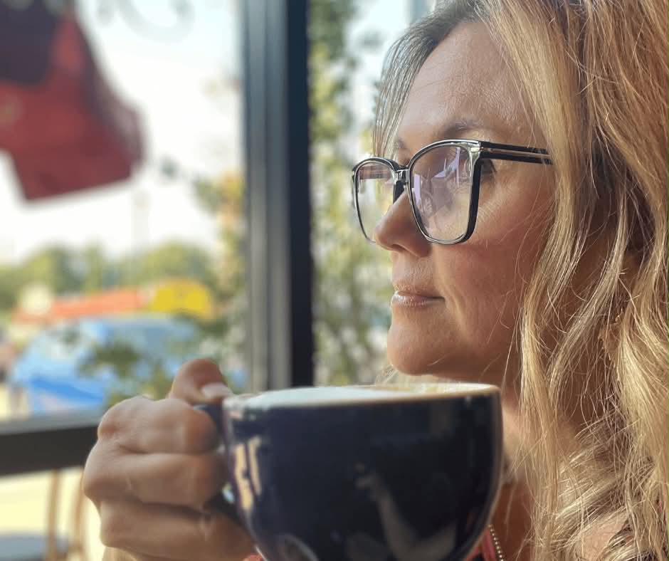 Shana Williams enjoying a coffee by the window at a local East Texas café